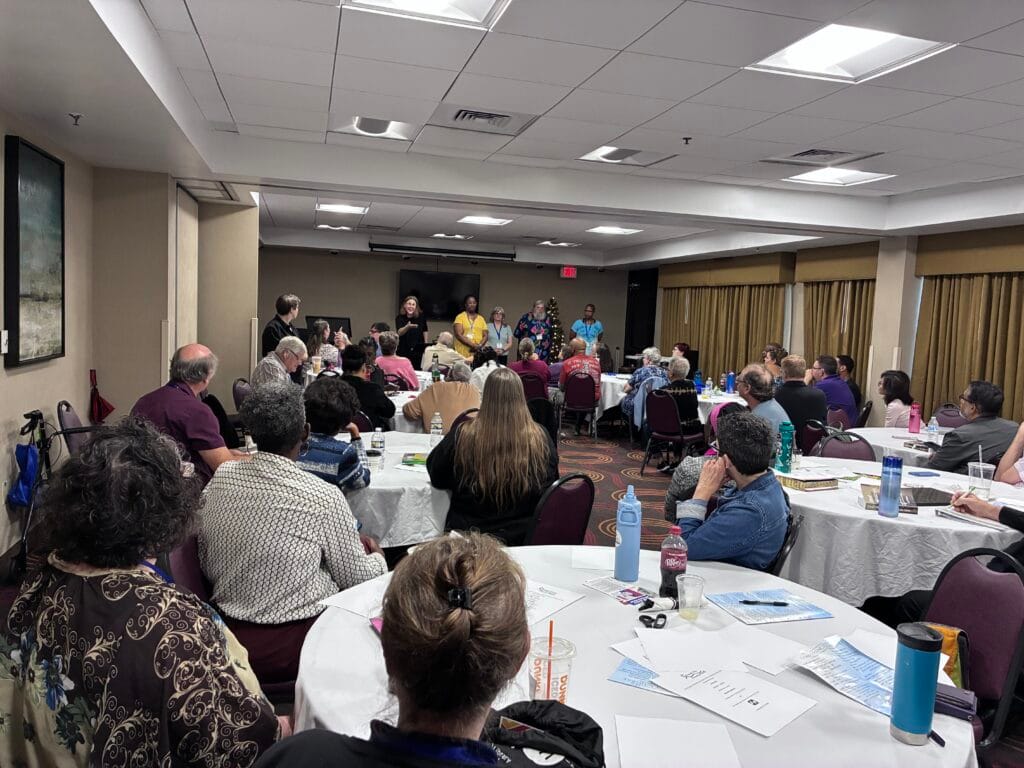 Attendees at the UMCD Conference in an activity.